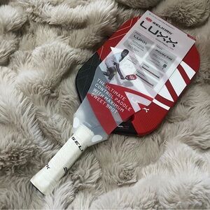 Red and white pickleball paddle